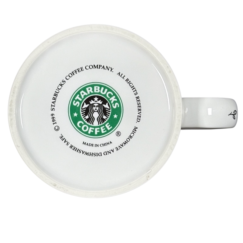 Bottom view of white vintage Starbucks 1999 collectible Chicago mug showing green logo copyright and manufacturing marks