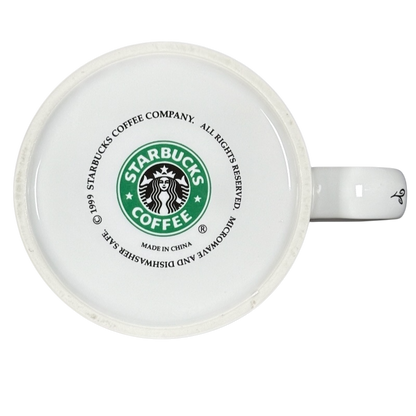 Bottom view of white vintage Starbucks 1999 collectible Chicago mug showing green logo copyright and manufacturing marks