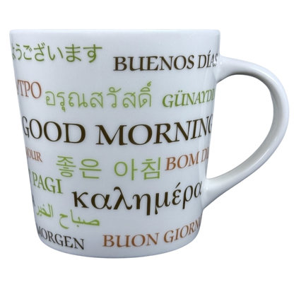 White ceramic vintage Starbucks Good Morning mug. Multilingual Good Morning text printed in green and brown