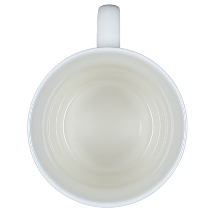 Top view of empty white ceramic vintage Starbucks Good Morning mug showing handle and interior concentric rings