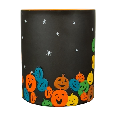 vintage Starbucks Halloween pumpkin mug black matte cup with orange interior and colorful smiling jack o lanterns