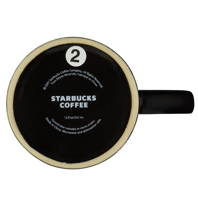 Bottom view of vintage Starbucks Halloween pumpkin mug showing Starbucks Coffee logo and 12 fl oz marking