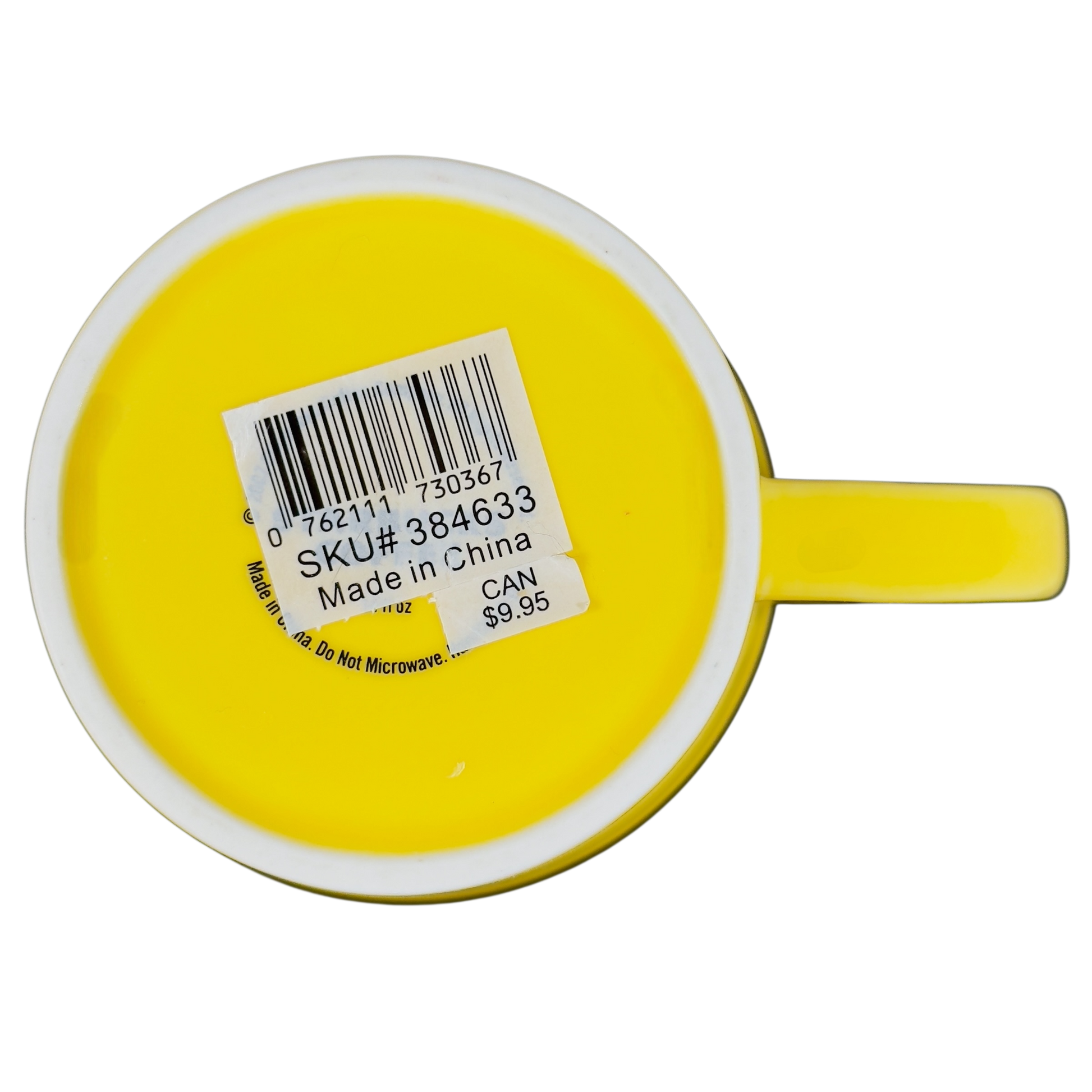 Bottom view of vintage Starbucks yellow sand pail mug showing SKU label and handle