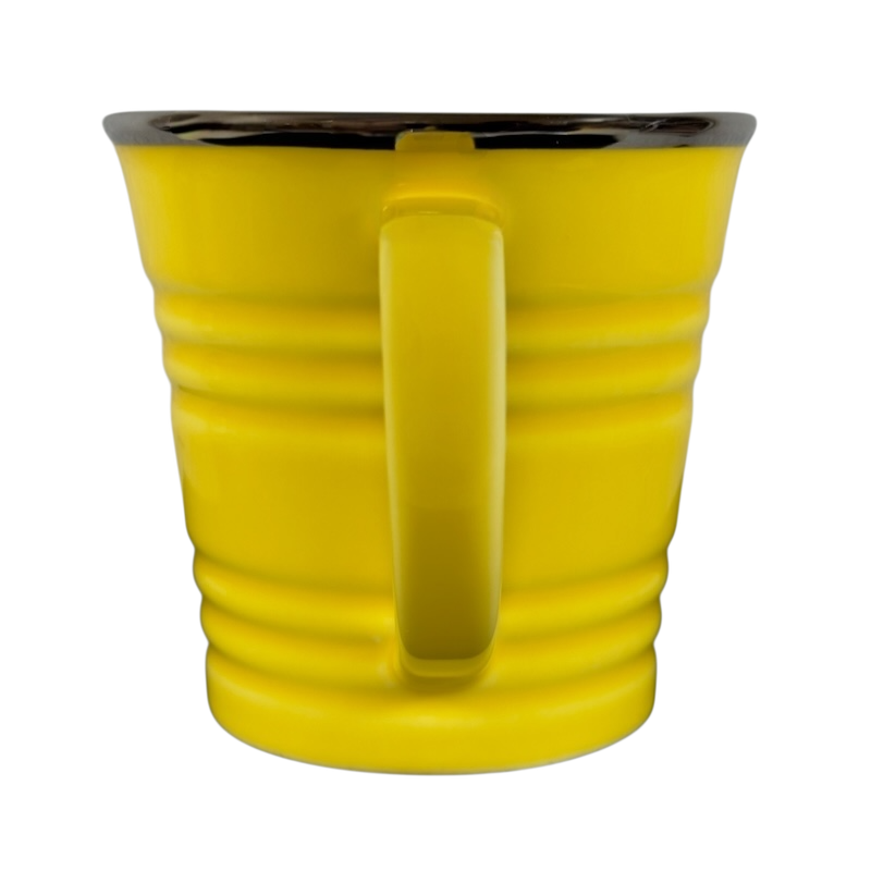 Vintage Starbucks yellow sand pail mug with a bright yellow body and smooth handle
