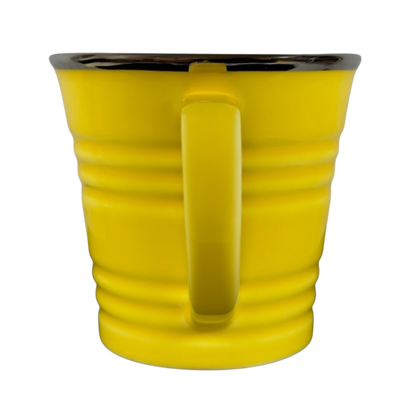 Vintage Starbucks yellow sand pail mug with a bright yellow body and smooth handle