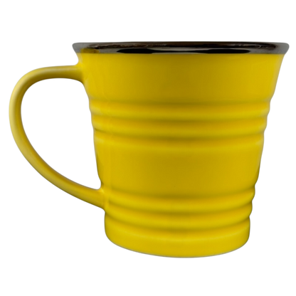 Vintage Starbucks yellow sand pail mug with ridged design and large handle
