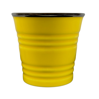 Vintage Starbucks yellow sand pail mug with black rim and textured ridges
