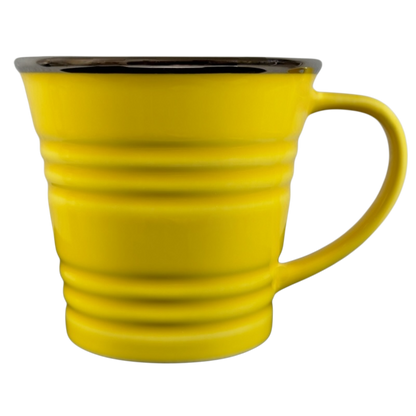 Vintage Starbucks yellow sand pail mug with ridged design and smooth handle