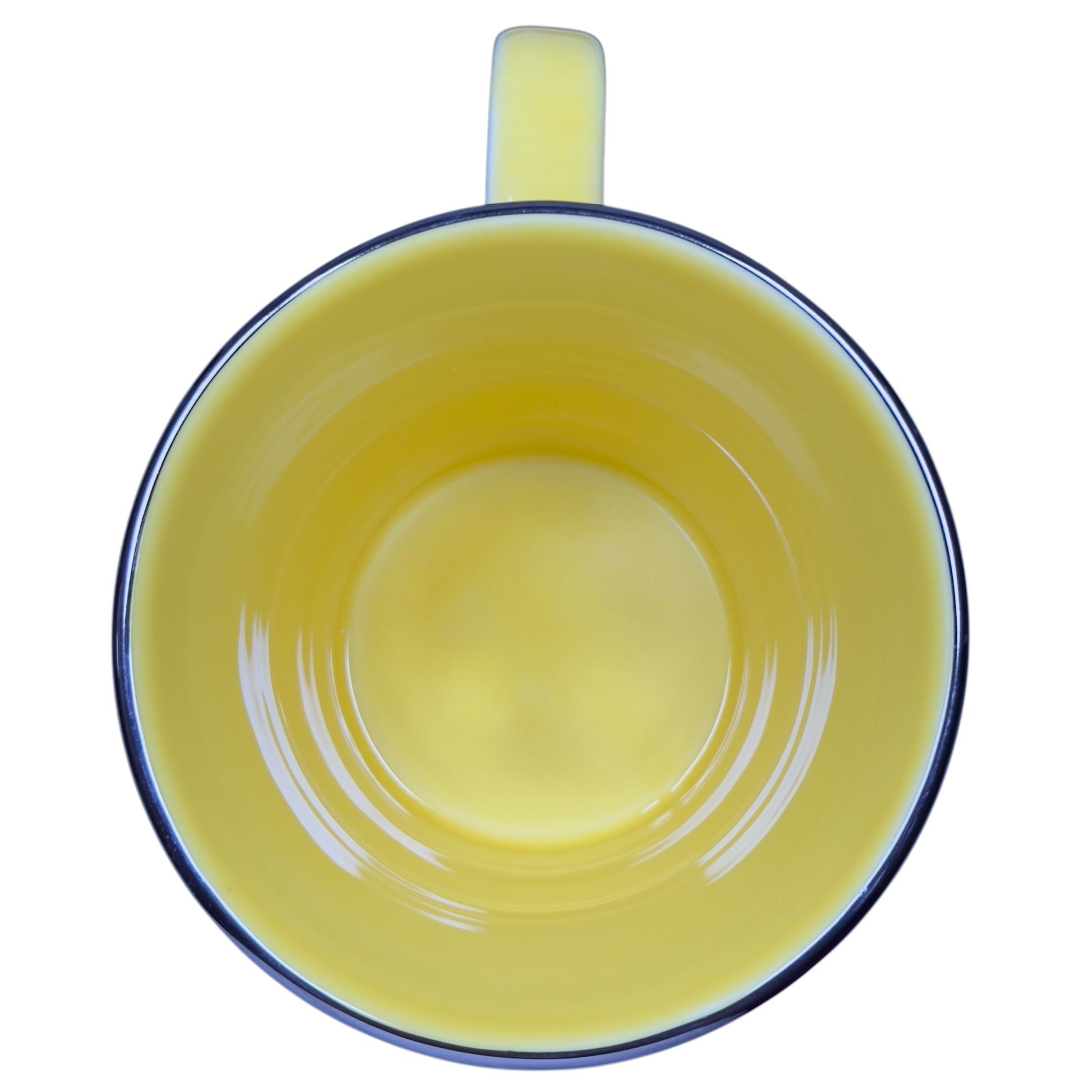 Top view of vintage Starbucks yellow sand pail mug showing bright yellow interior and handle