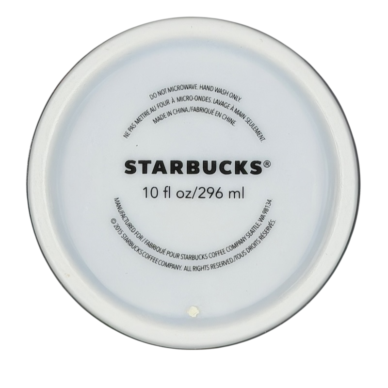 Bottom view of a Starbucks watercolor hearts collectible tumbler showing its capacity and care instructions