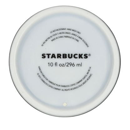 Bottom view of a Starbucks watercolor hearts collectible tumbler showing its capacity and care instructions