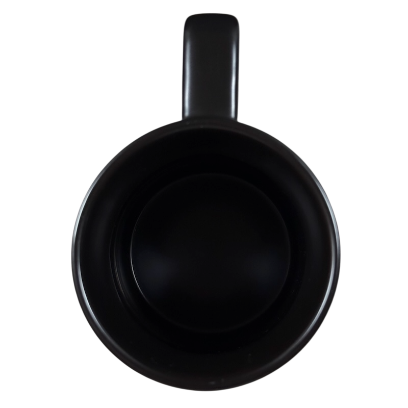 Top view of black ceramic Yiqiao Wang American Sign Language Starbucks mug empty glossy handle at top