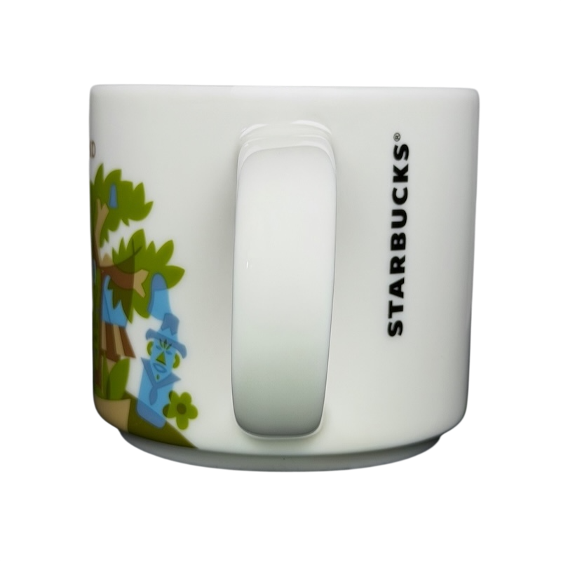 You Are Here Collection Disneyland Adventureland Mug Starbucks with colorful jungle design