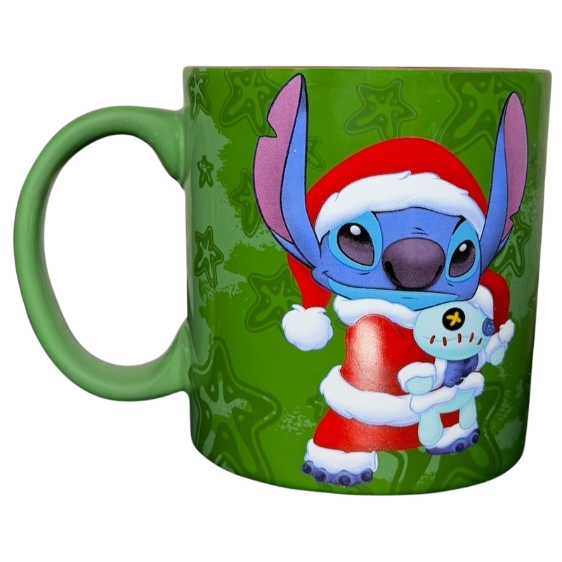 Disney Stitch Santa holiday collectible mug featuring Stitch in a Santa outfit holding a small character