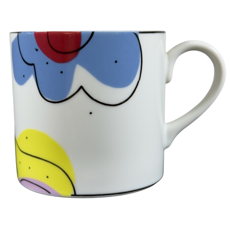 Swid Powell collectible mug featuring colorful abstract designs and a stylish handle