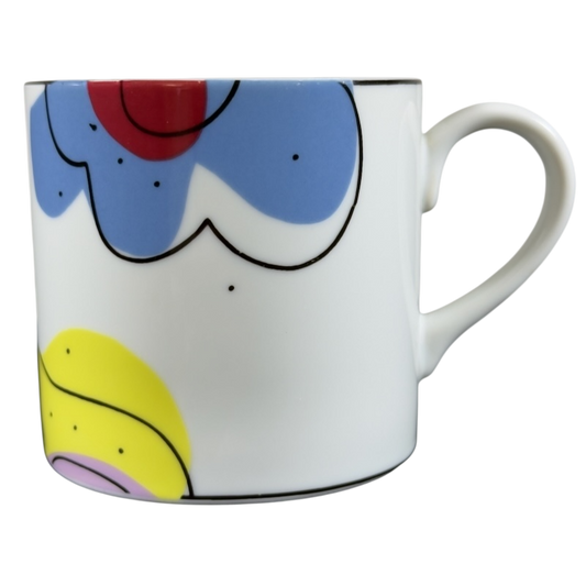 Swid Powell collectible mug featuring colorful abstract designs and a stylish handle