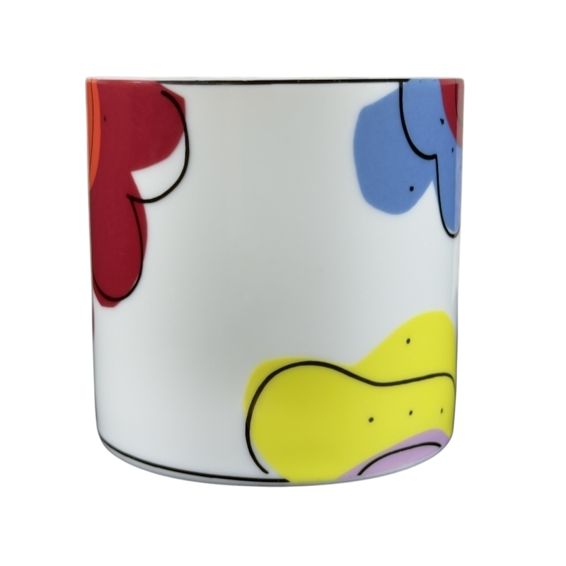 Swid Powell collectible mug featuring a colorful floral design on a white background