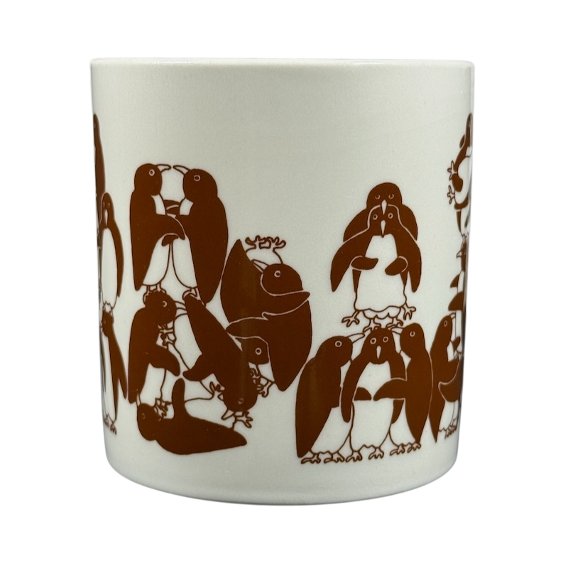 Taylor & Ng Animates vintage brown penguins mug featuring playful penguin illustrations in warm brown tones