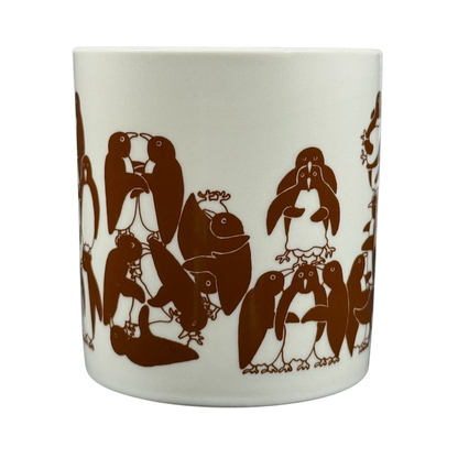 Taylor & Ng Animates vintage brown penguins mug featuring playful penguin illustrations in warm brown tones