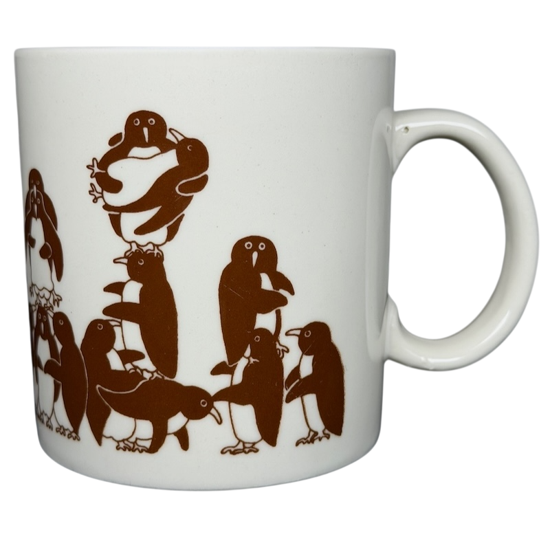 Taylor & Ng Animates vintage brown penguins mug featuring playful penguins in a fun design