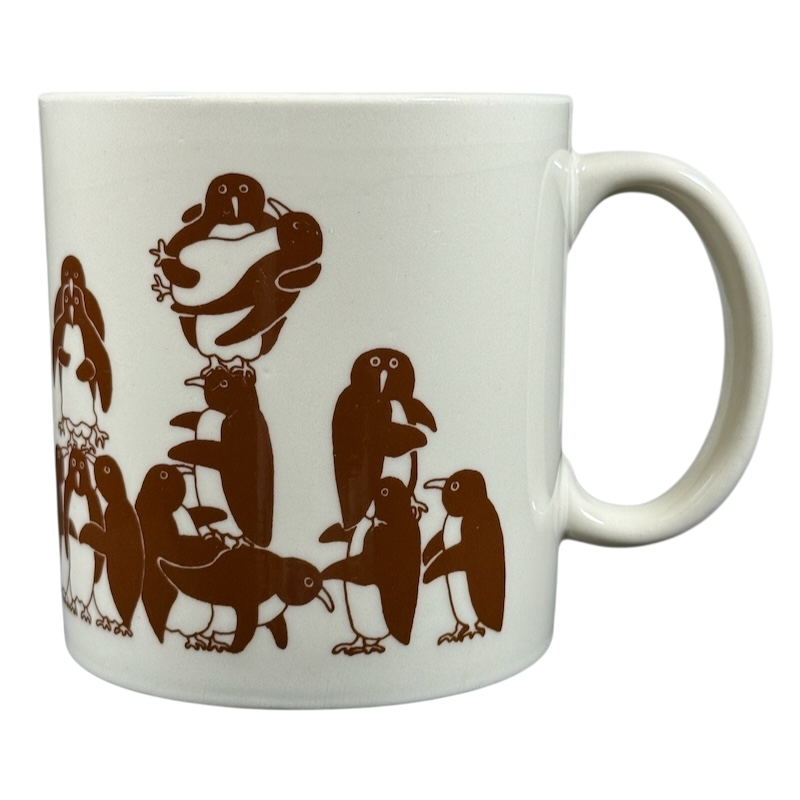 Taylor & Ng Animates vintage brown penguins mug featuring playful penguin designs in brown