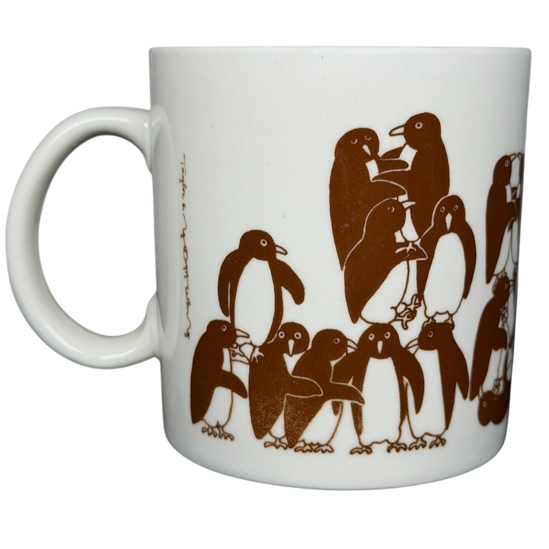 Taylor & Ng Animates vintage brown penguins mug featuring playful penguins in a charming design
