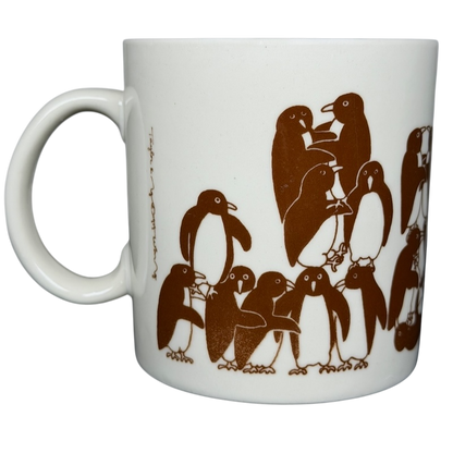 Taylor & Ng Animates vintage brown penguins mug featuring playful penguins in a charming design