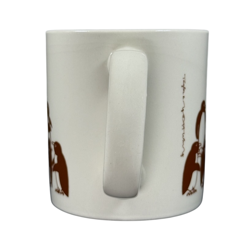 Taylor & Ng Animates vintage brown penguins mug featuring playful penguin designs on a white ceramic surface
