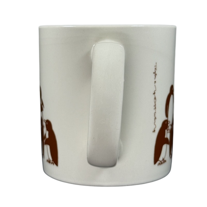 Taylor & Ng Animates vintage brown penguins mug featuring playful penguin designs on a white ceramic surface
