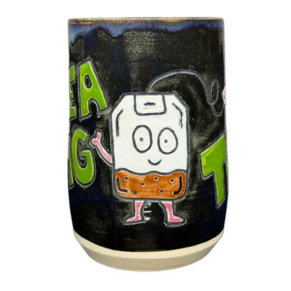 Tea Bag Time Pottery Mug Duck Yeah featuring a cute cartoon tea bag design on a dark background