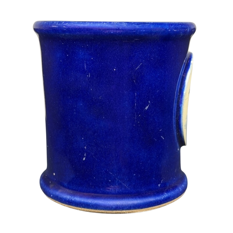 The Broadmoor Colorado Pottery Mug in vibrant blue with a smooth finish and classic design