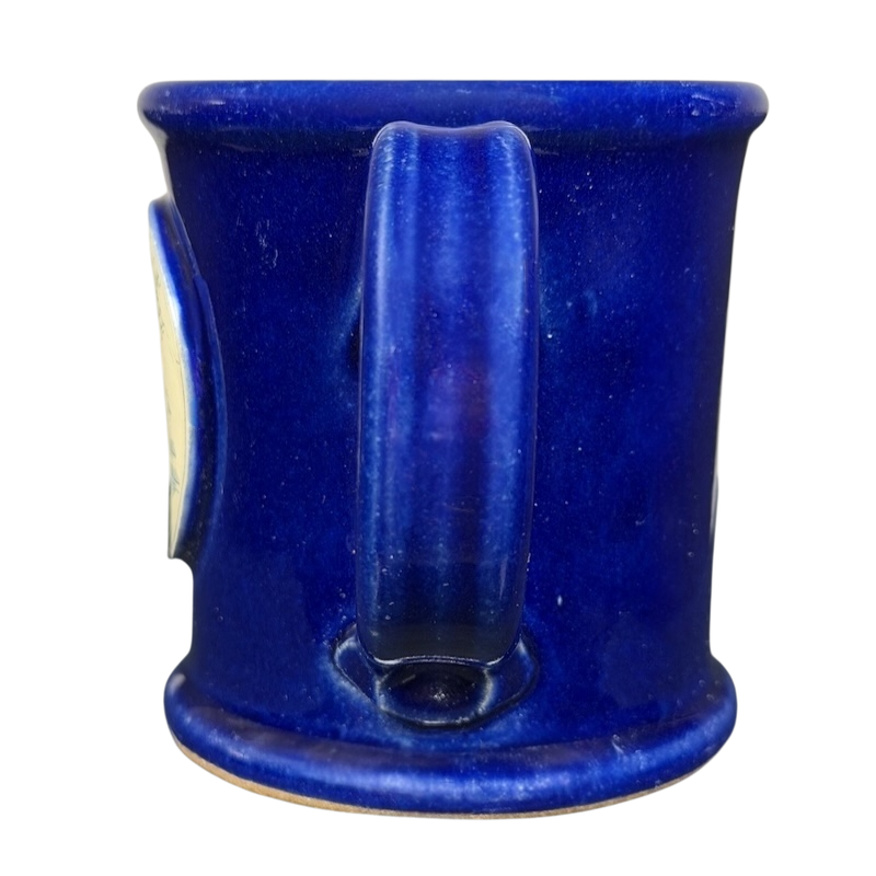 The Broadmoor Colorado Pottery Mug in vibrant blue with a smooth finish and sturdy handle