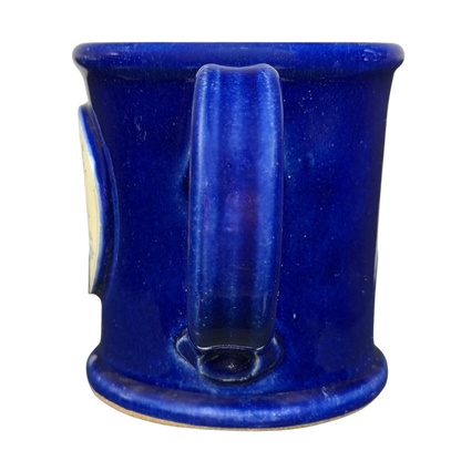The Broadmoor Colorado Pottery Mug in vibrant blue with a smooth finish and sturdy handle