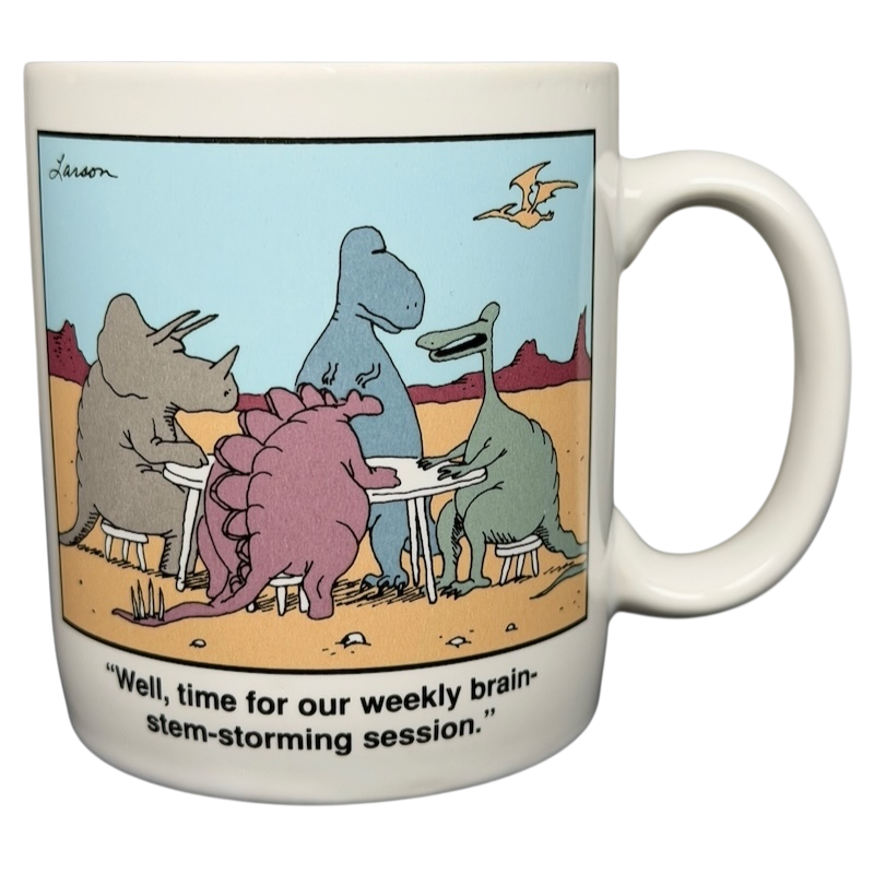 The Far Side dinosaur mug featuring cartoon dinosaurs at a brainstorming session in a desert scene