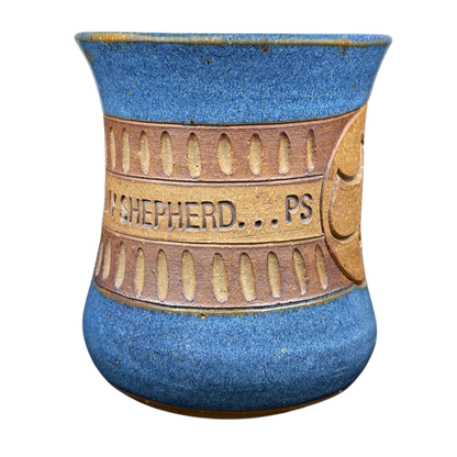 Handcrafted pottery mug featuring 'The Lord is My Shepherd' design in blue and brown colors