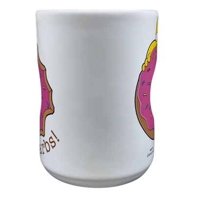 The Simpsons Homer Universal Studios donut mug featuring Homer holding a pink donut