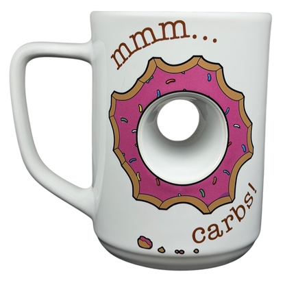 The Simpsons Homer Universal Studios donut mug featuring a donut design and the text mmm carbs