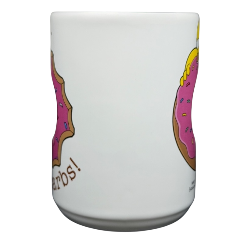 The Simpsons Homer Universal Studios donut mug featuring colorful donut graphics and fun text