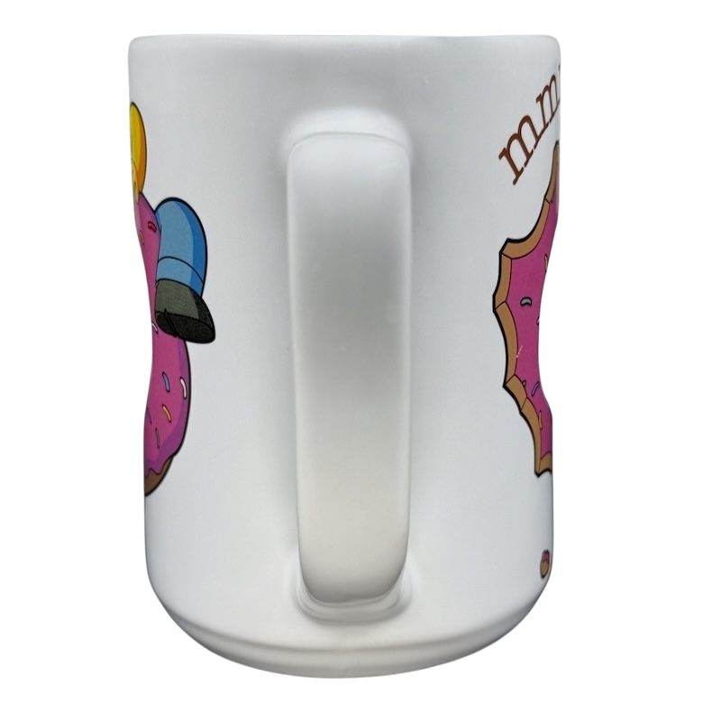 The Simpsons Homer Universal Studios donut mug featuring colorful donut graphics for fans and collectors