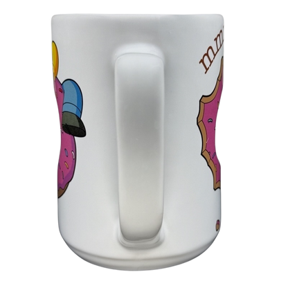 The Simpsons Homer Universal Studios donut mug featuring colorful donut graphics for fans and collectors