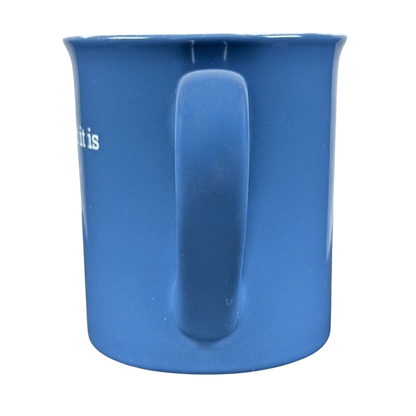THL blue ceramic mug with handle facing forward featuring white text it is what it is rare mug on black background