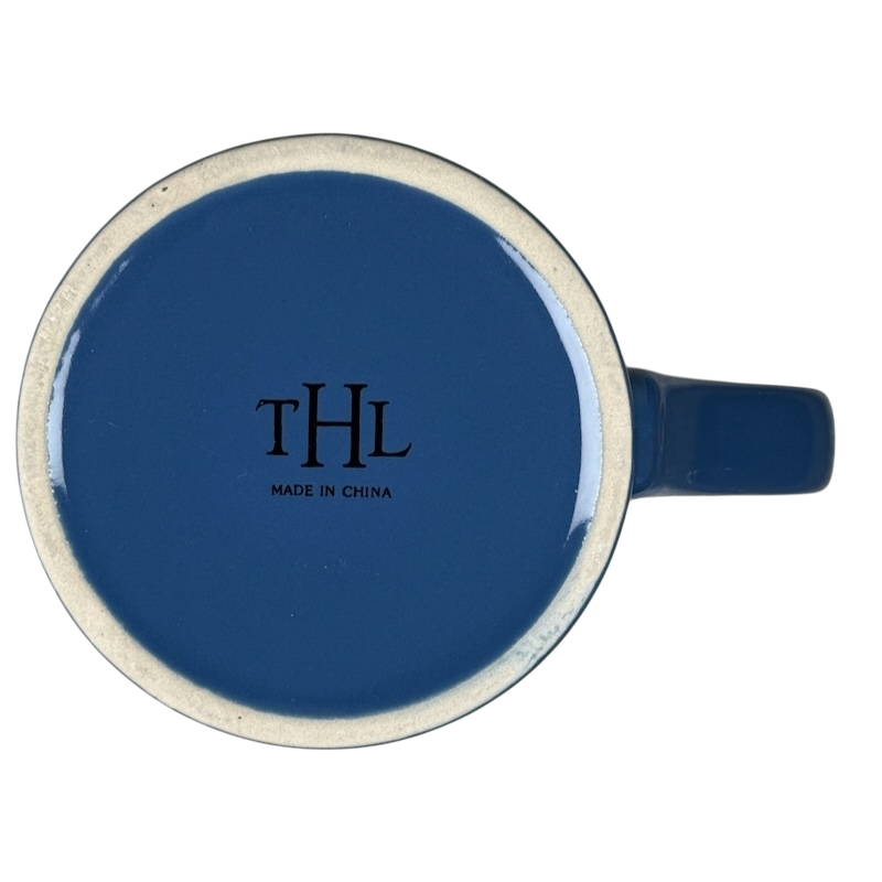 Top view of blue ceramic THL mug showing underside logo and handle it is what it is rare mug
