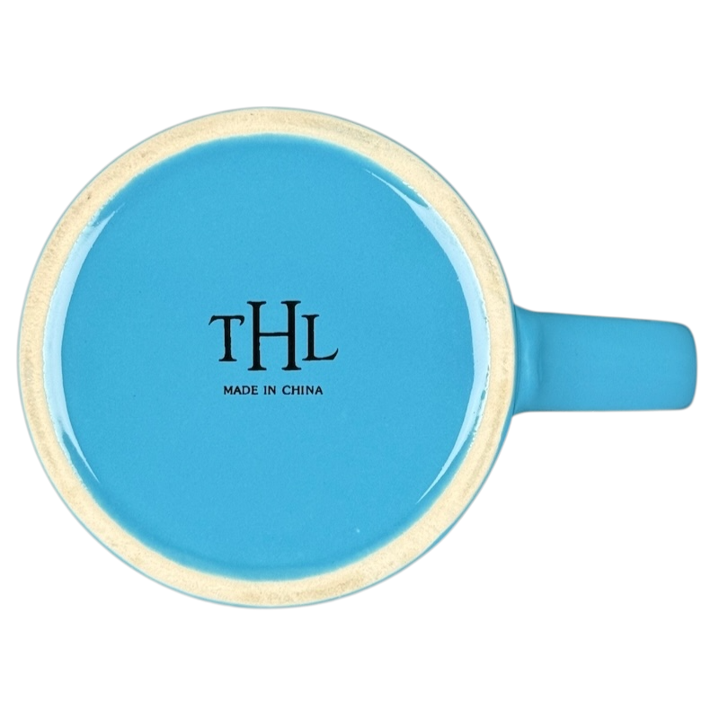 make it happen blue THL mug top view showing stamped THL Made in China on glossy blue ceramic base with handle to right