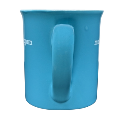 make it happen blue THL mug showing front handle centered on blue ceramic cup with white side text