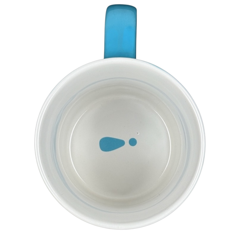 Top view of make it happen blue THL mug white interior with center blue droplet logo and blue handle