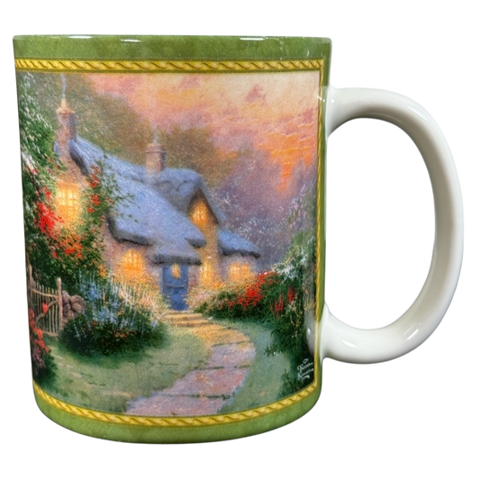 Thomas Kinkade Glory of Evening vintage coffee mug featuring a glowing cottage scene with lush garden and sunset sky