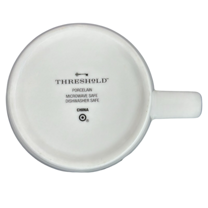 Bottom view of Threshold Aries Astrology Zodiac Mug showcasing porcelain and care instructions