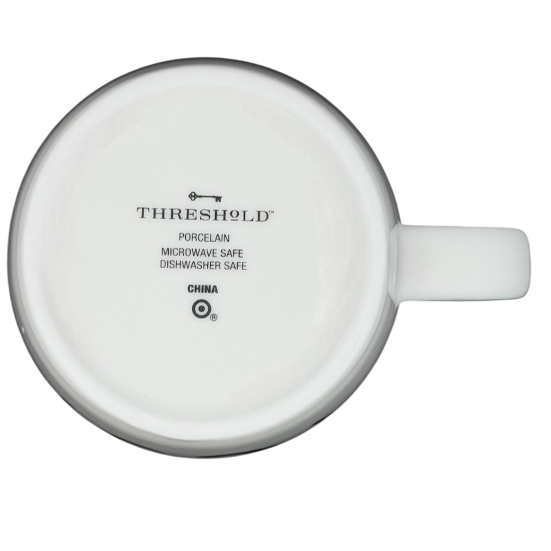 Bottom view of a Threshold Cancer Astrology Zodiac Mug showing porcelain and care instructions
