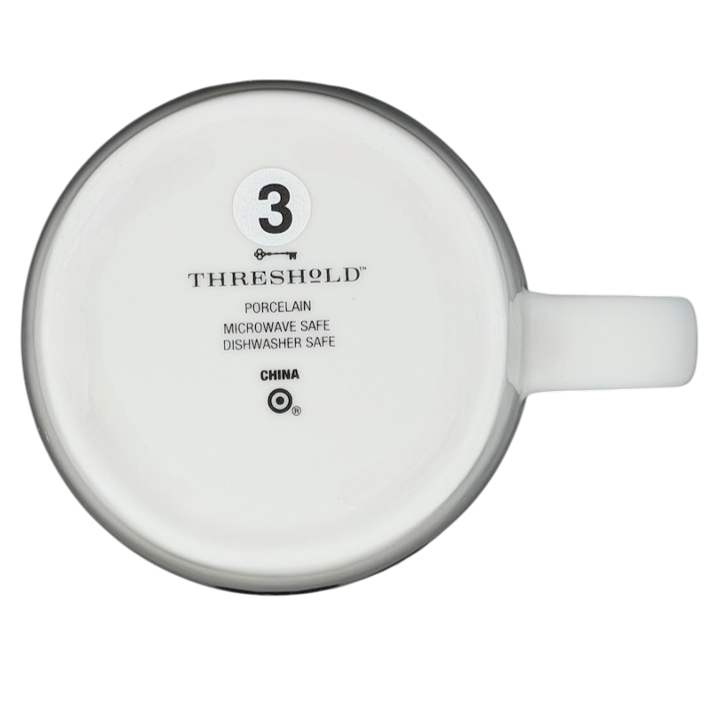 Bottom view of the Threshold Libra Astrology Zodiac Mug with care instructions and materials listed