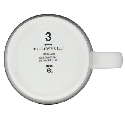 Bottom view of the Threshold Libra Astrology Zodiac Mug with care instructions and materials listed
